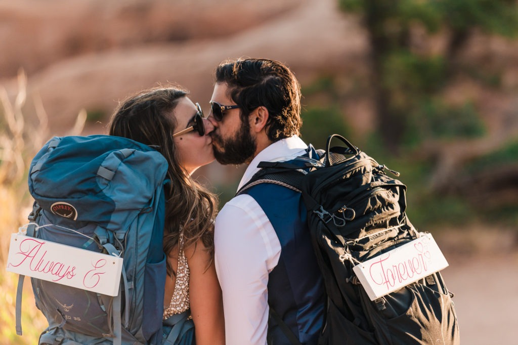 Elopement Ideas: cute backpack signs saying 'Always and Forever'.