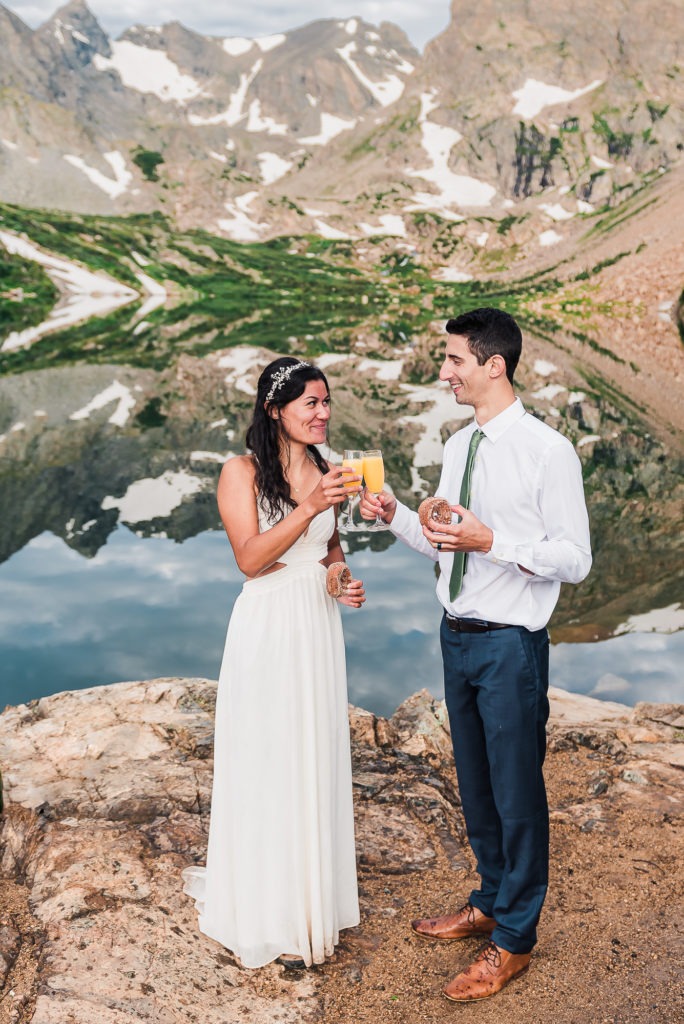 Elopement ideas. The couples celebrate their Colorado mountain adventure with champagne and donuts.