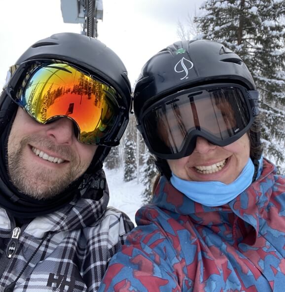 Chad and Vanessa wear winter ski & snowboarding gear on the slopes.